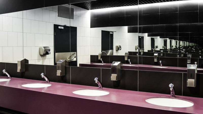 Why did this college suddenly decide to remove all the mirrors from its toilets ?