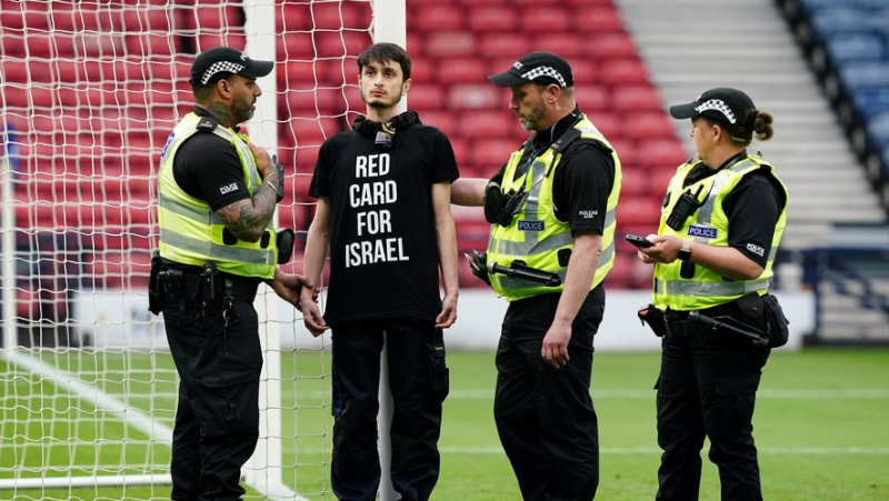 Pro-Palestinian protester chains himself to goal to delay kick-off of Scotland-Israel match