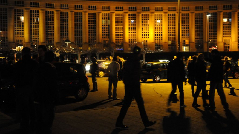 Party girl rebels against police officers with handbags outside music bar on Place de l’Europe in Montpellier