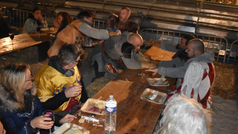 The crowd enjoys great feasts in a medieval atmosphere